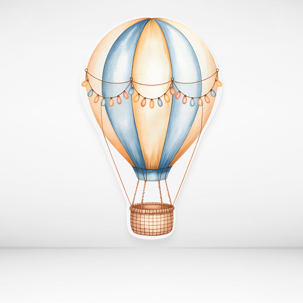 Hot air balloon cardboard cutout with blue and orange design on a light gray background