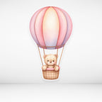 Hot air balloon cardboard cutout with pink and purple design on a light gray background
